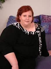 Pretty brunette bbw Amnita fondles with her big plump tits while sucking off a black dong