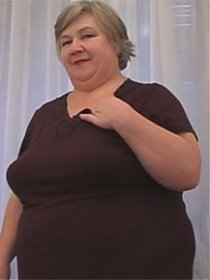 Fat grandmother takes off her clothes to show off her succulent body