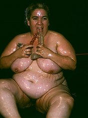 Naughty BBW covered in goo while a horny guy examines her big fat tits and enormous booty live